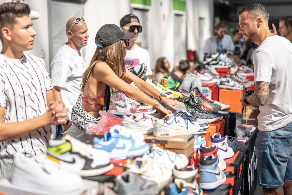 Shoppers browsing at the OnSize stand at a sneaker event