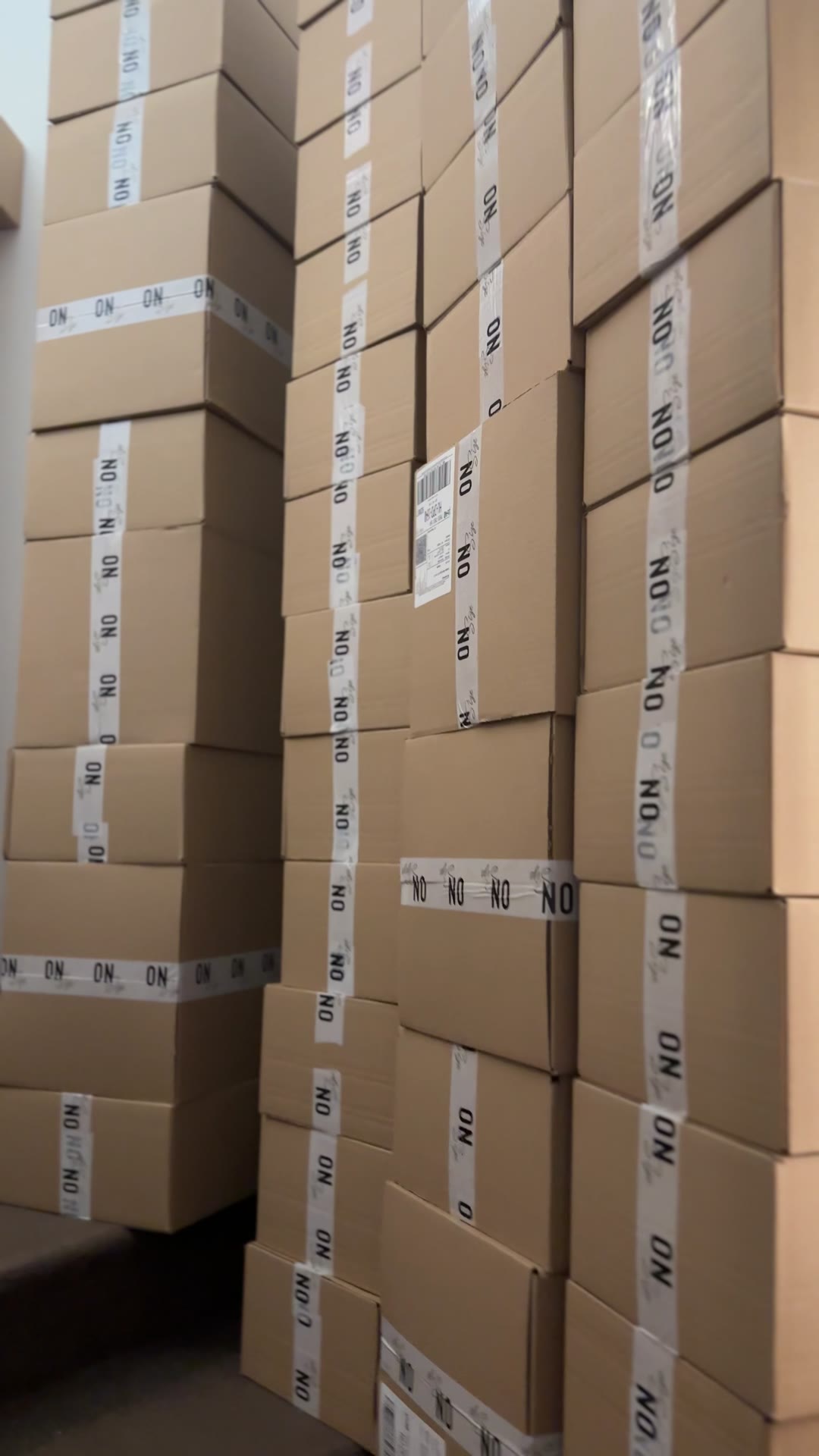 Towers of OnSize boxes in the first store's stockroom, even on the stairs