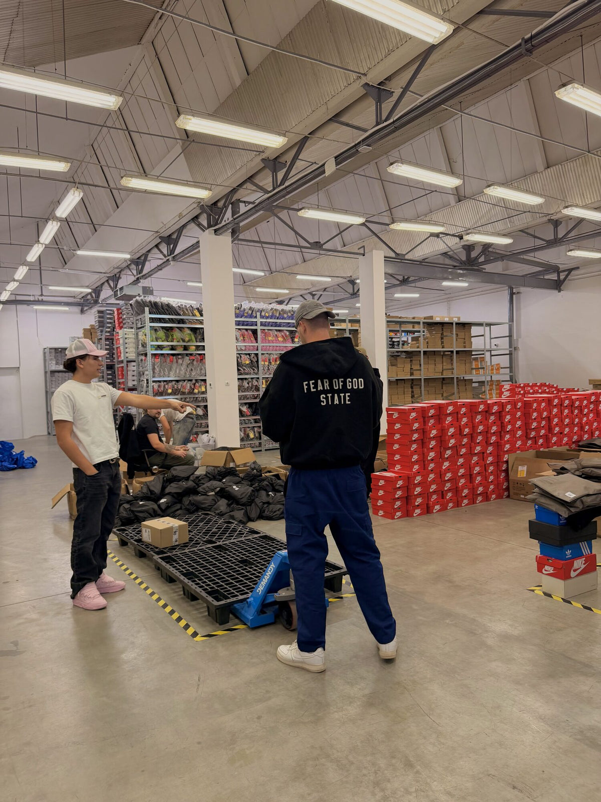 Inside the new hall, with pallets, shelves and boxes